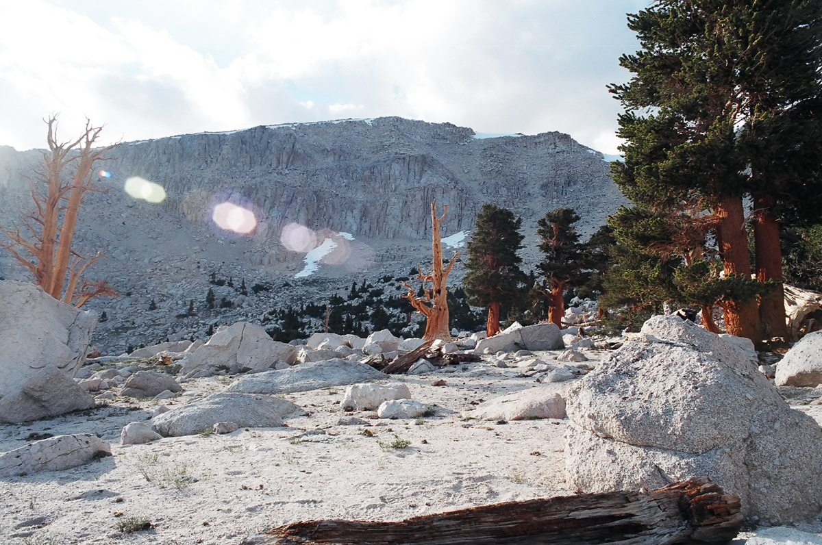 Towering granite mountains near a small cirque
