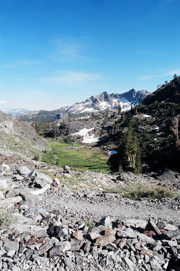 Trail tread up through a valley.