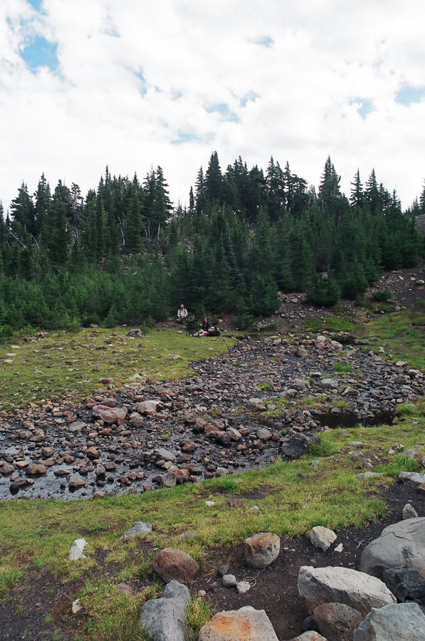 Trees, grass, creek, and volcanic rock...Cool.